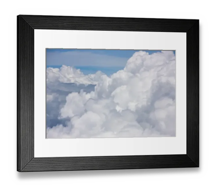 Framed Print : Cumulus clouds as seen from high above the tropical coastline of Costa Rica