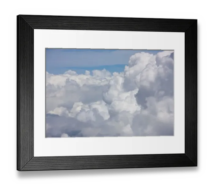 Framed Print : Cumulus clouds as seen from high above the tropical coastline of Costa Rica