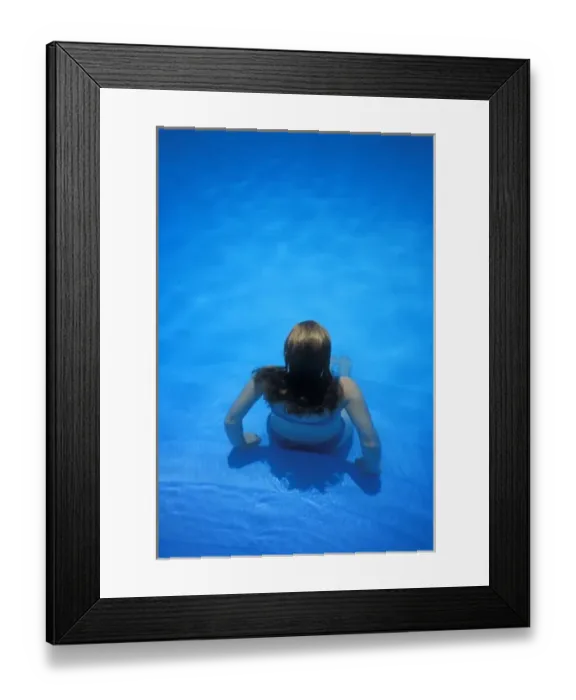 Framed Print : Woman sitting on edge of pool, Manuel Antonia National Park, Costa Rica, MR Framed Print : Woman sitting on edge of pool, Manuel Antonia National Park, Costa Rica, MR