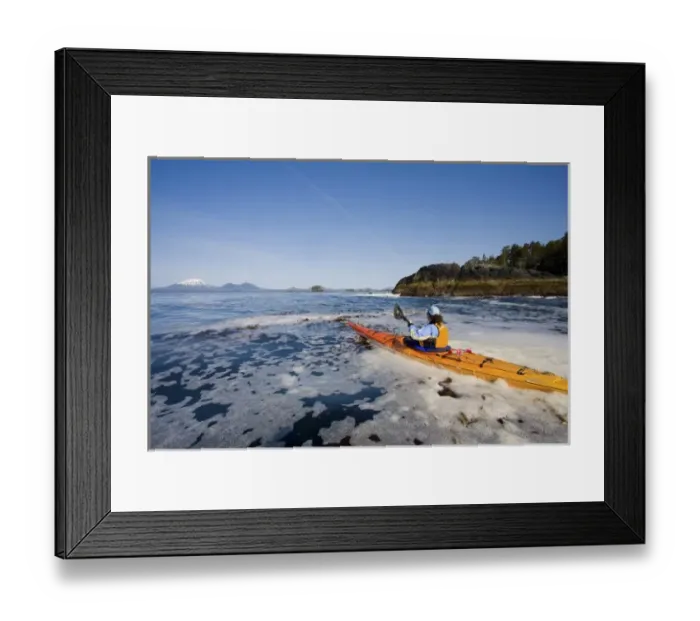 Framed Print : USA, Alaska, Sitka Sound. Woman sea kayaker on calm sea near Kruzof Island, Mt. Edgecumbe Framed Print : USA, Alaska, Sitka Sound. Woman sea kayaker on calm sea near Kruzof Island, Mt. Edgecumbe