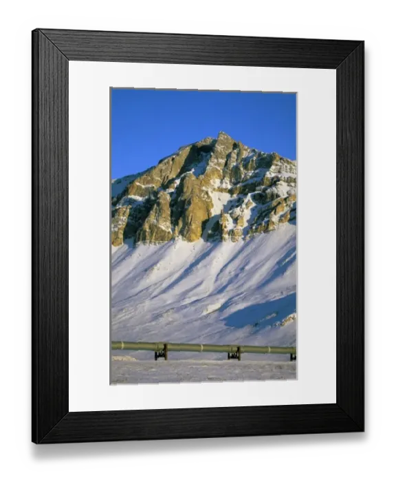 Framed Print : USA, Alaska, Brooks Range. Snow covered mountains tower over the Trans-Alaskan Oil