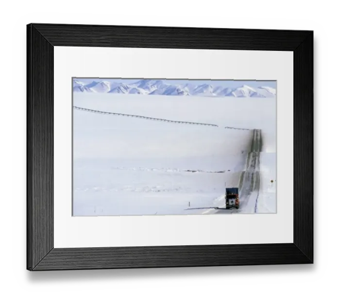Framed Print : USA, Alaska, Brooks Range. Truck drives on the ice covered haul road to Prudhoe Bay