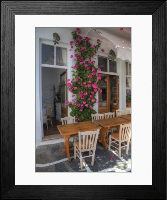 Framed Print : Greece, Mykonos, Hora, Restaurant with outside seating and lovely Pink Geranium growing