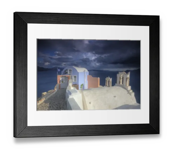 Framed Print : Greece, Santorini, Evening light in Oia town with bell towers and colorful building on point Framed Print : Greece, Santorini, Evening light in Oia town with bell towers and colorful building on point