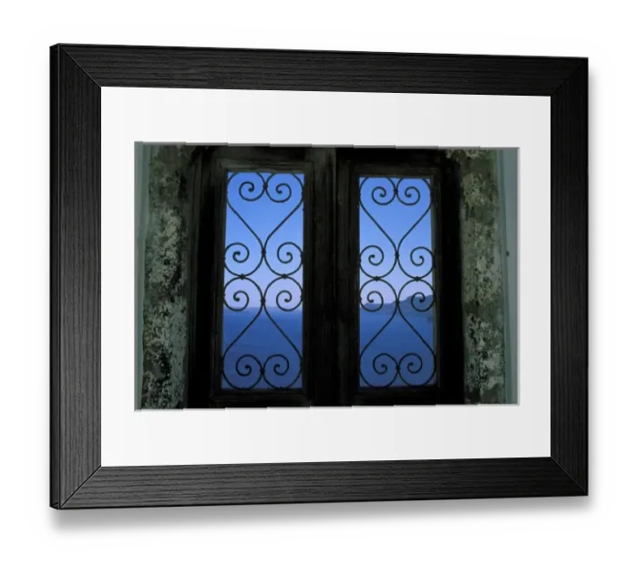 Framed Print : Oia, Santorini, Greece, Looking through an ornate iron window to the Aegean Sea