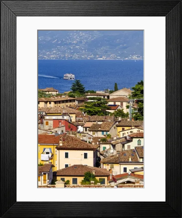 Framed Print : Italy, Lake Garda. A ferry on Lake Garda approaches the village of Limone Framed Print : Italy, Lake Garda. A ferry on Lake Garda approaches the village of Limone