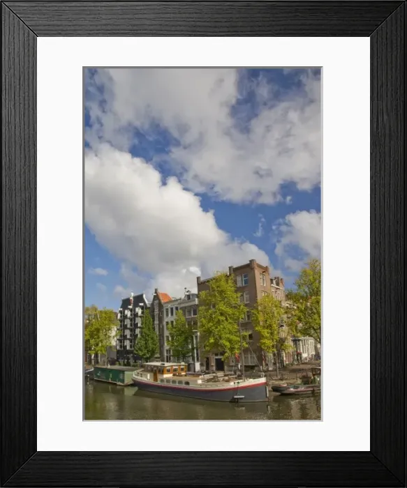 Framed Print : Colorful houseboats line an Amsterdam canal Framed Print : Colorful houseboats line an Amsterdam canal