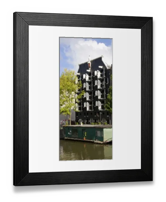 Framed Print : Unknown. Green houseboat along a canal with an ornate black Framed Print : Unknown. Green houseboat along a canal with an ornate black