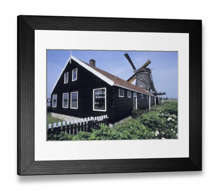 Framed Print : Europe, Netherlands, Amsterdam. A neat millhouse accompanies a willmill in the Amsterdam Framed Print : Europe, Netherlands, Amsterdam. A neat millhouse accompanies a willmill in the Amsterdam