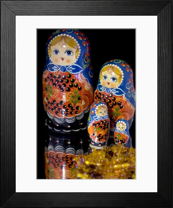 Framed Print : Russia, Russian handicrafts. Traditional painted matryoshka dolls, and amber. Property released