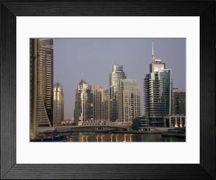 Framed Print : UAE, Dubai. Tower lights reflect on marina water at night