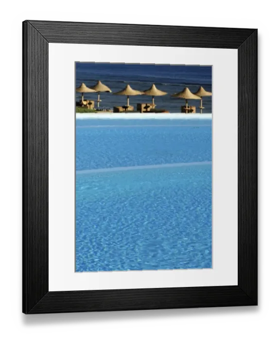 Framed Print : Africa, Egypt, Marsa Alam, Red Sea, beachside pool and umbrellas