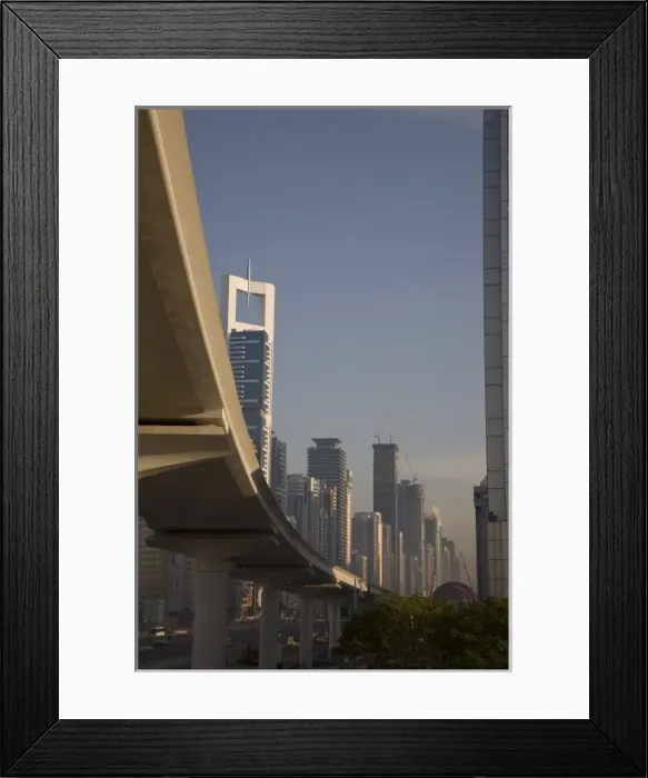 Framed Print : UAE, Dubai. Metro transit platform along Sheik Zayed Road, with Chelsea Tower in background