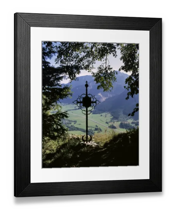 Framed Print : Germany, Bavaria. A wrought-iron cross occupies a secluded overlook in Bavaria, Germany