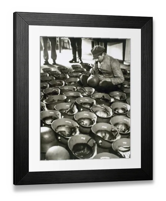 Framed Print : Manufacture of the German army helmets during World War II (1939-1945) Framed Print : Manufacture of the German army helmets during World War II (1939-1945)