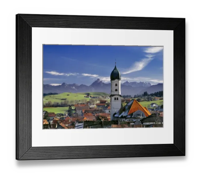 Framed Print : Germany, Bavaria, Nesselwang. The spire of a village church stands out from the mountains peaks