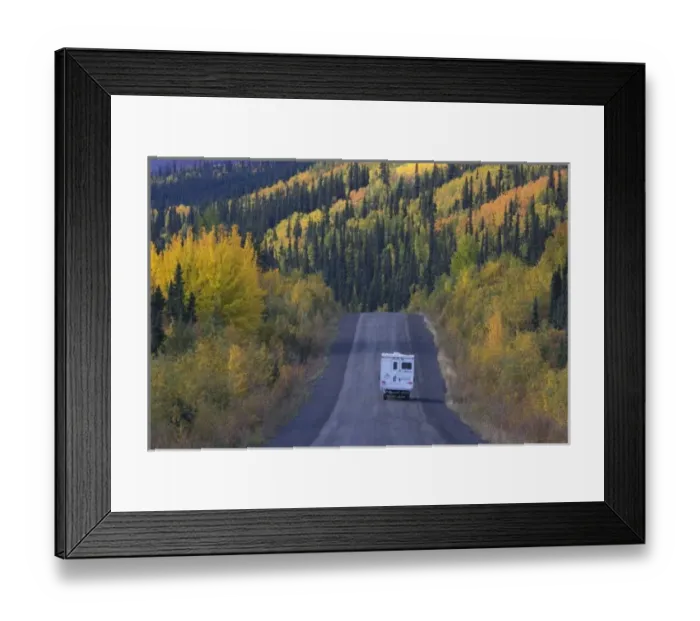 Framed Print : Dempster Highway winding through mountains and forests in fall colors, northern Yukon Framed Print : Dempster Highway winding through mountains and forests in fall colors, northern Yukon