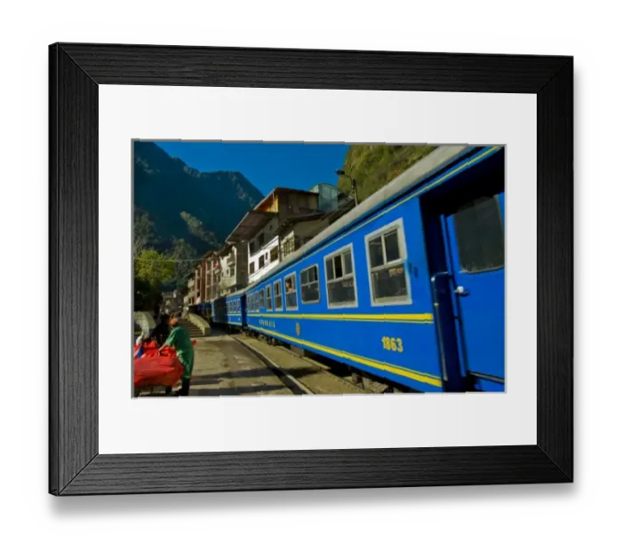 Framed Print : Passenger trains run right down the main street of the small village of Aguas Calientes Framed Print : Passenger trains run right down the main street of the small village of Aguas Calientes