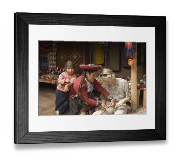 Framed Print : Tourist learns to weave on traditional foot loom, Chinchero, Department of Cuzco, Peru