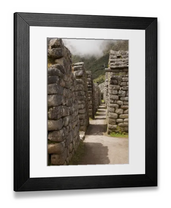 Framed Print : South America, Peru, Machu Picchu. Looking down a row of stone house ruins. (UNESCO Framed Print : South America, Peru, Machu Picchu. Looking down a row of stone house ruins. (UNESCO