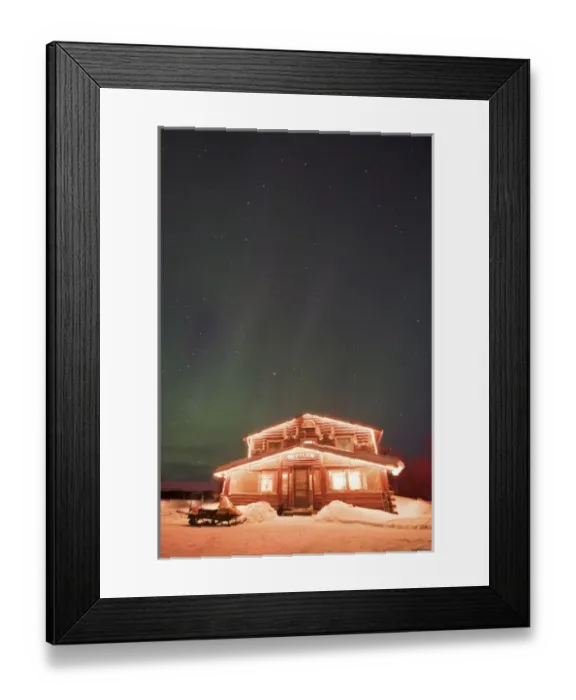 Framed Print : USA, Alaska, Bettles. The landmark Bettles Lodge lit beneath the northern lights