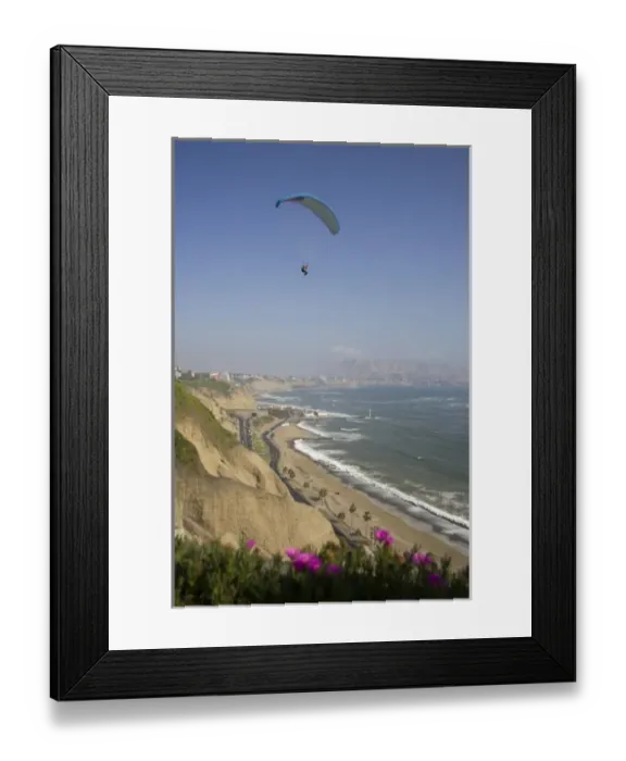 Framed Print : Parasailor soars over cliffs and ocean in Miraflores neighborhood, Lima, Peru Framed Print : Parasailor soars over cliffs and ocean in Miraflores neighborhood, Lima, Peru