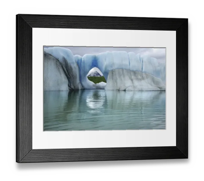 Framed Print : USA, Alaska, Alsek Lake. View of mountain through hole in iceberg