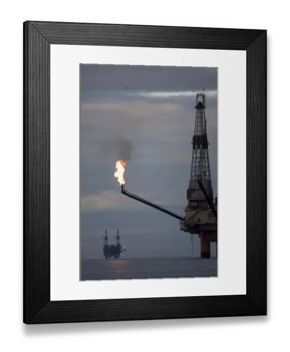 Framed Print : USA, Alaska, Offshore oil drilling rigs with burning natural gas flares in Cook Inlet Framed Print : USA, Alaska, Offshore oil drilling rigs with burning natural gas flares in Cook Inlet