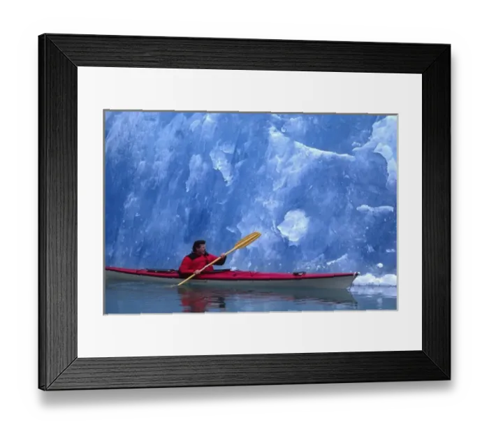Framed Print : North America, USA, Alaska, Tracy Arm. Art Wolfe in a kayak beside blue glacial ice. (MR) Framed Print : North America, USA, Alaska, Tracy Arm. Art Wolfe in a kayak beside blue glacial ice. (MR)
