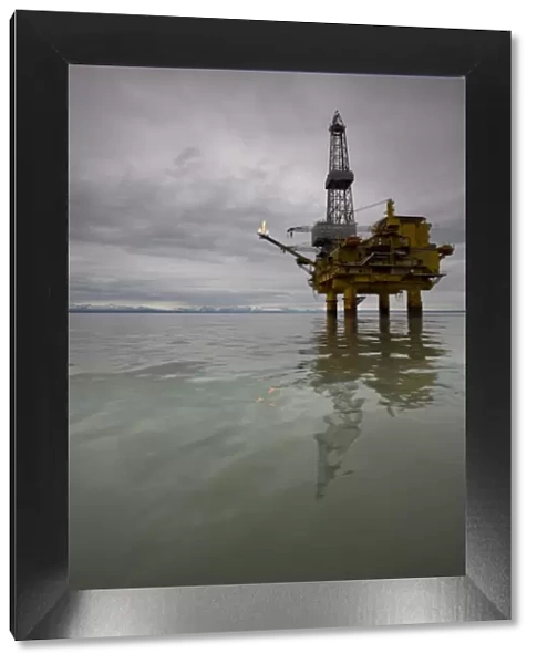 USA, Alaska, Offshore oil drilling rig in Cook Inlet on summer evening