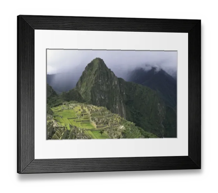 Framed Print : The ruins of the Machu Picchu citadel lie between the peak of Huayna Picchu