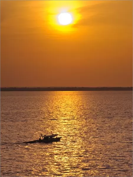Amazon River, Brazil. Fishermen at sunset