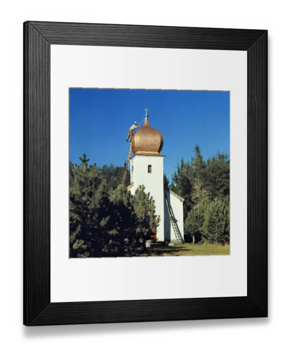 Framed Print : South America, Argentina, San Carlos de Bariloche. A man repairs the roof of a small Framed Print : South America, Argentina, San Carlos de Bariloche. A man repairs the roof of a small