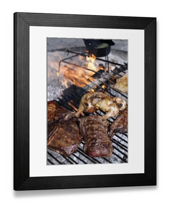 Framed Print : Argentina, El Calafate. Parrillada (mixed grilled meat) cooking on a grill