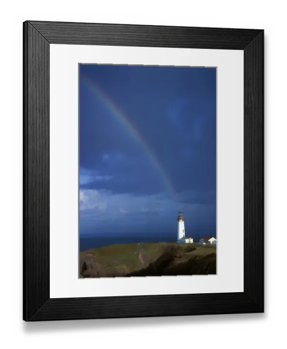 Framed Print : Rainbow drops down onto Yakina Bay lighthouse on the coast near Newport, Oregon