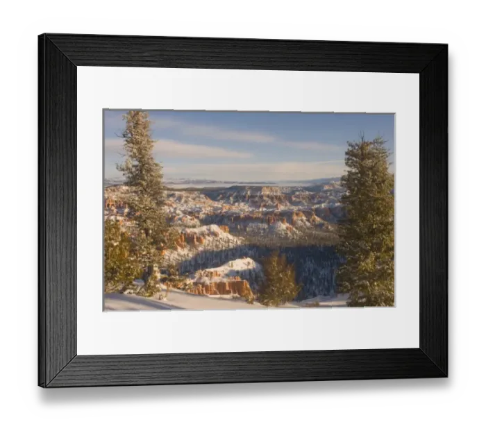 Framed Print : Snowy winter landscape of the hoodoo--a pillar of rock left by erosion--structures