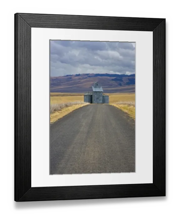 Framed Print : Gravel Road leading up to Grain elevators in Eastern Oregon off of Hwy. 395 south Framed Print : Gravel Road leading up to Grain elevators in Eastern Oregon off of Hwy. 395 south
