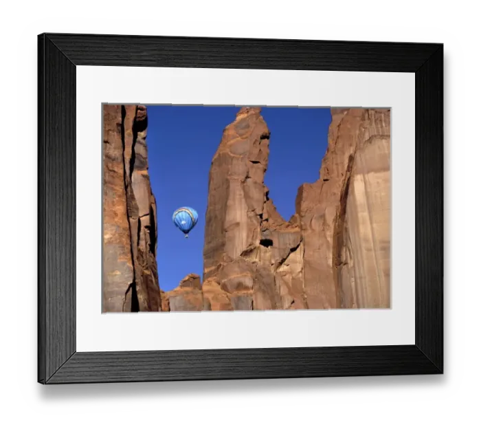 Framed Print : USA, Utah, Monument Valley. A hot-air balloon is suspended in Monument Valley, Utah Framed Print : USA, Utah, Monument Valley. A hot-air balloon is suspended in Monument Valley, Utah