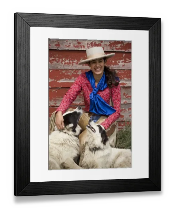 Framed Print : USA, Oregon, Seneca, Ponderosa Ranch. Portrait of a smiling cowgirl and her two dogs Framed Print : USA, Oregon, Seneca, Ponderosa Ranch. Portrait of a smiling cowgirl and her two dogs