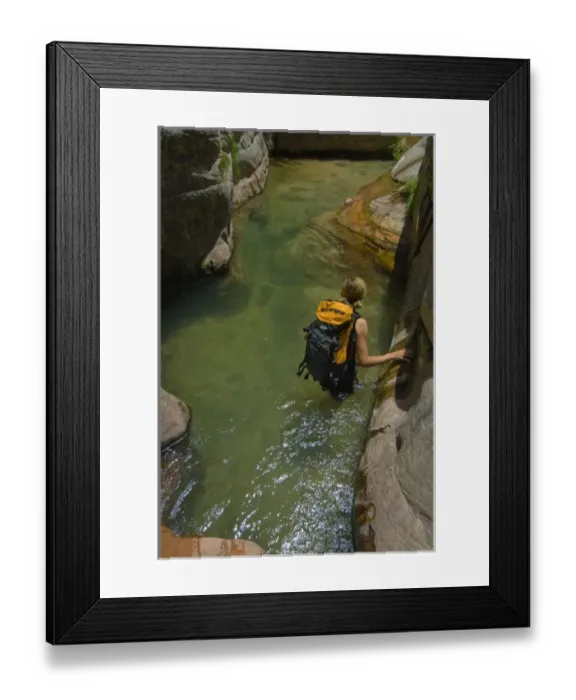 Framed Print : USA, Utah, Zion National Park. A female canyoneer in the Subway. (MR)