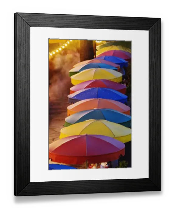 Framed Print : Colorful umbrellas of outdoor cafe and blurred people in motion along famous River Walk Framed Print : Colorful umbrellas of outdoor cafe and blurred people in motion along famous River Walk