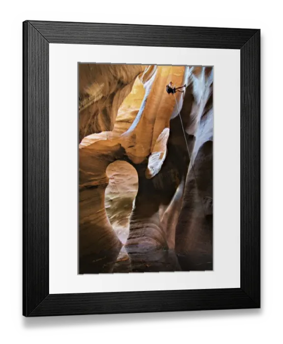 Framed Print : USA, Utah, Zion National Park. A female canyoneer rappels into the Golden Cathedral of Pine Creek Framed Print : USA, Utah, Zion National Park. A female canyoneer rappels into the Golden Cathedral of Pine Creek
