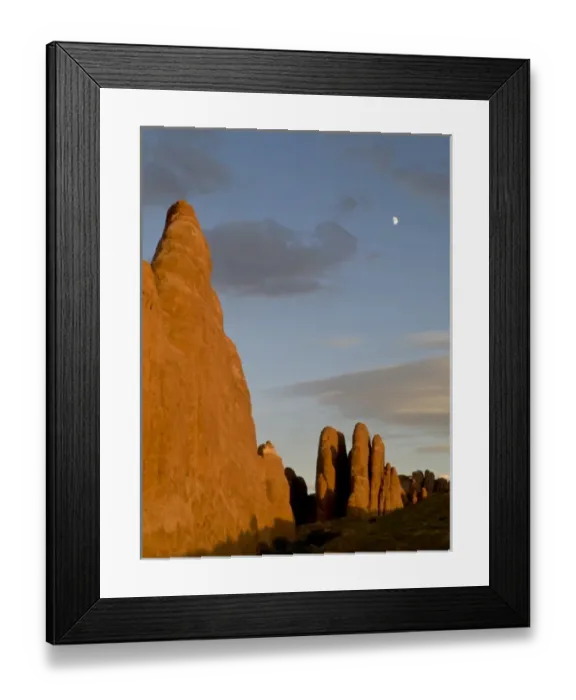 Framed Print : Sunset light and rock fins in north end of Arches National Park, UT, with moon in sky