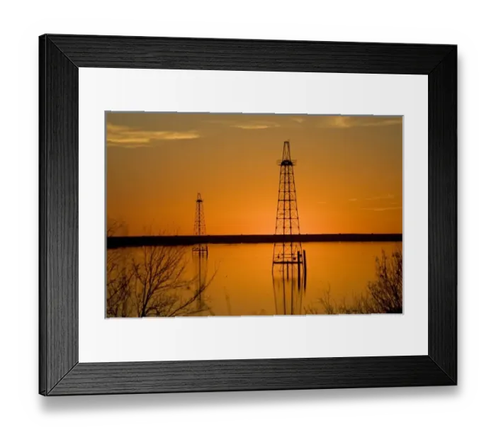 Framed Print : Oil well derricks in Lake Arrowhead near Wichita Falls, Texas, USA at sunset, winter