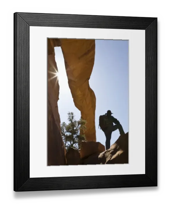 Framed Print : USA, Utah, Arches National Park. Lone hiker stands under Wall Arch one month before it collapsed Framed Print : USA, Utah, Arches National Park. Lone hiker stands under Wall Arch one month before it collapsed