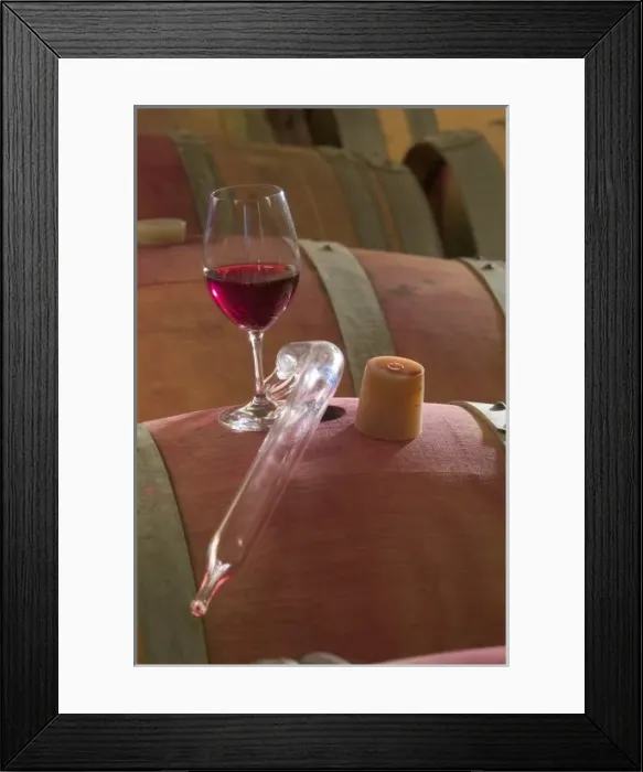 Framed Print : Wine thief and glass of red wine on top of barrel at Adelsheim Winery in the Willamette Framed Print : Wine thief and glass of red wine on top of barrel at Adelsheim Winery in the Willamette