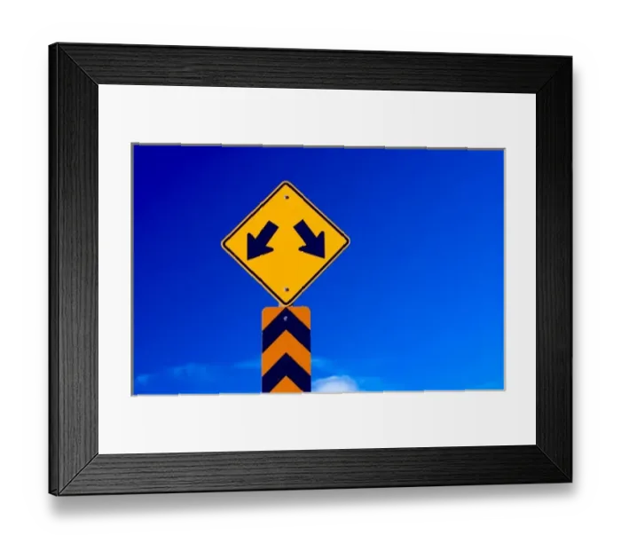 Framed Print : a double arrow traffic sign with a blue sky behind Framed Print : a double arrow traffic sign with a blue sky behind
