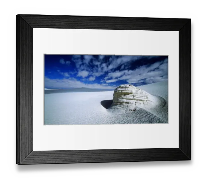 Framed Print : A clearing in the clouds allows for an ancient yardang to stand out in the middle Framed Print : A clearing in the clouds allows for an ancient yardang to stand out in the middle