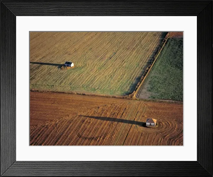 Framed Print : USA, North Dakota, Washburn. Late light throws long shadows off small barns in Framed Print : USA, North Dakota, Washburn. Late light throws long shadows off small barns in