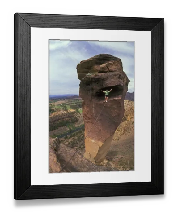 Framed Print : Solo rock climber walking cable stretched from free-standing Monkey Face rock to Framed Print : Solo rock climber walking cable stretched from free-standing Monkey Face rock to